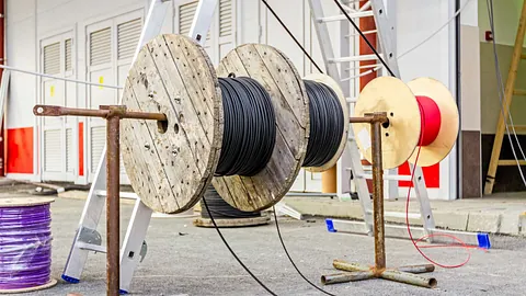 A large amount of cable being installed in a new build